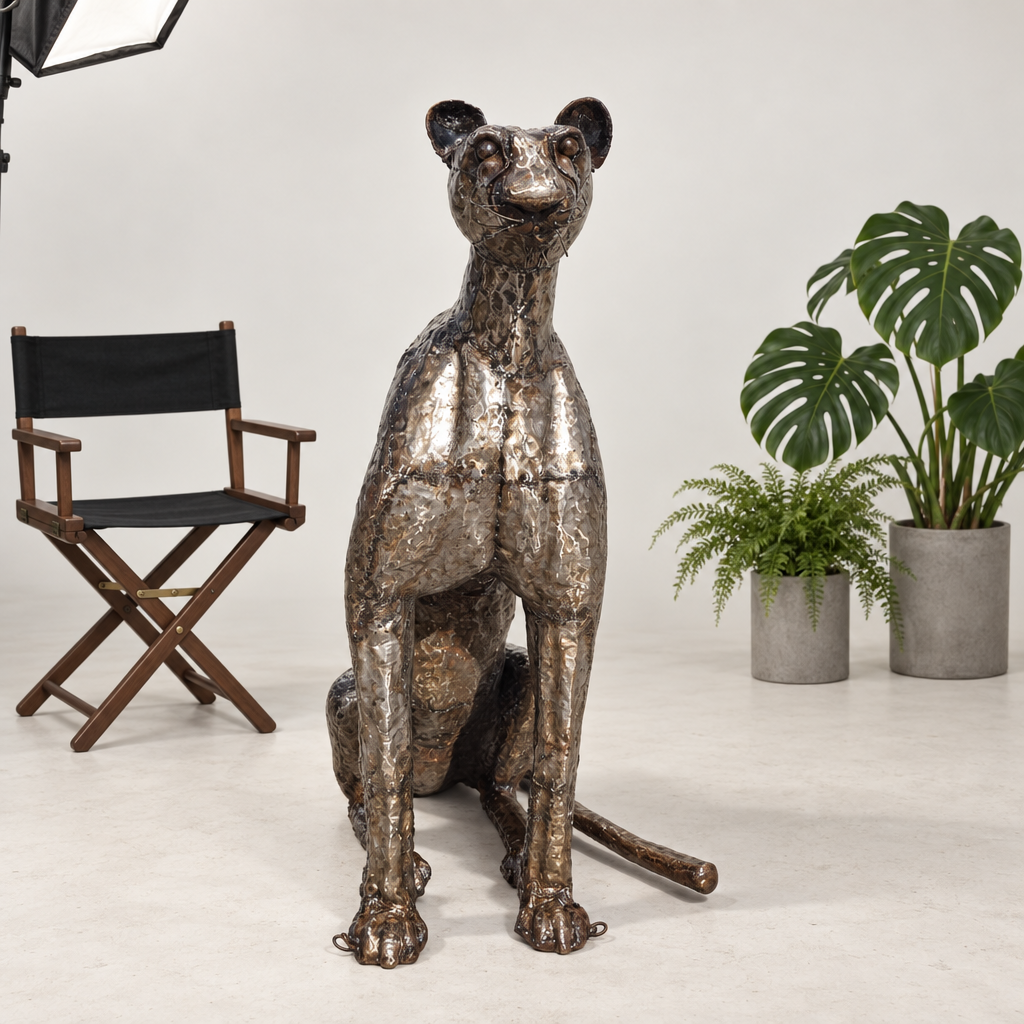 Sitting Cheetah Sculpture - Head Up, front view in the studio
