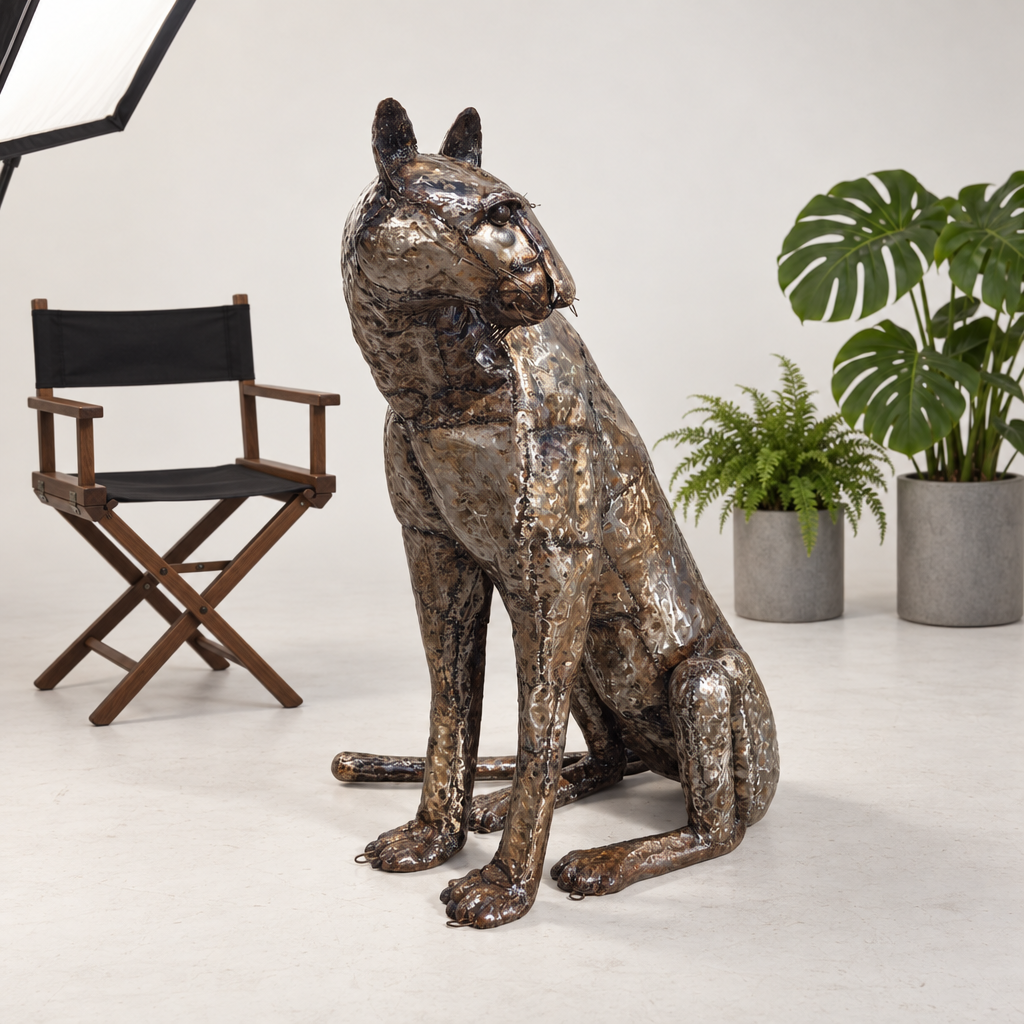 Sitting Cheetah Sculpture - Looking Left, front view in the studio