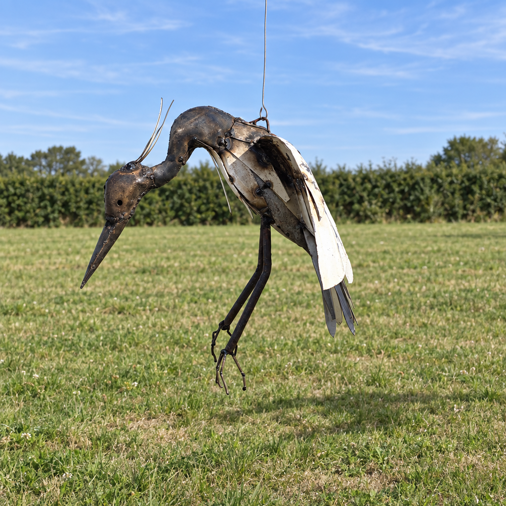 Hanging Heron Sculpture, three-quarter view in an outdoor setting