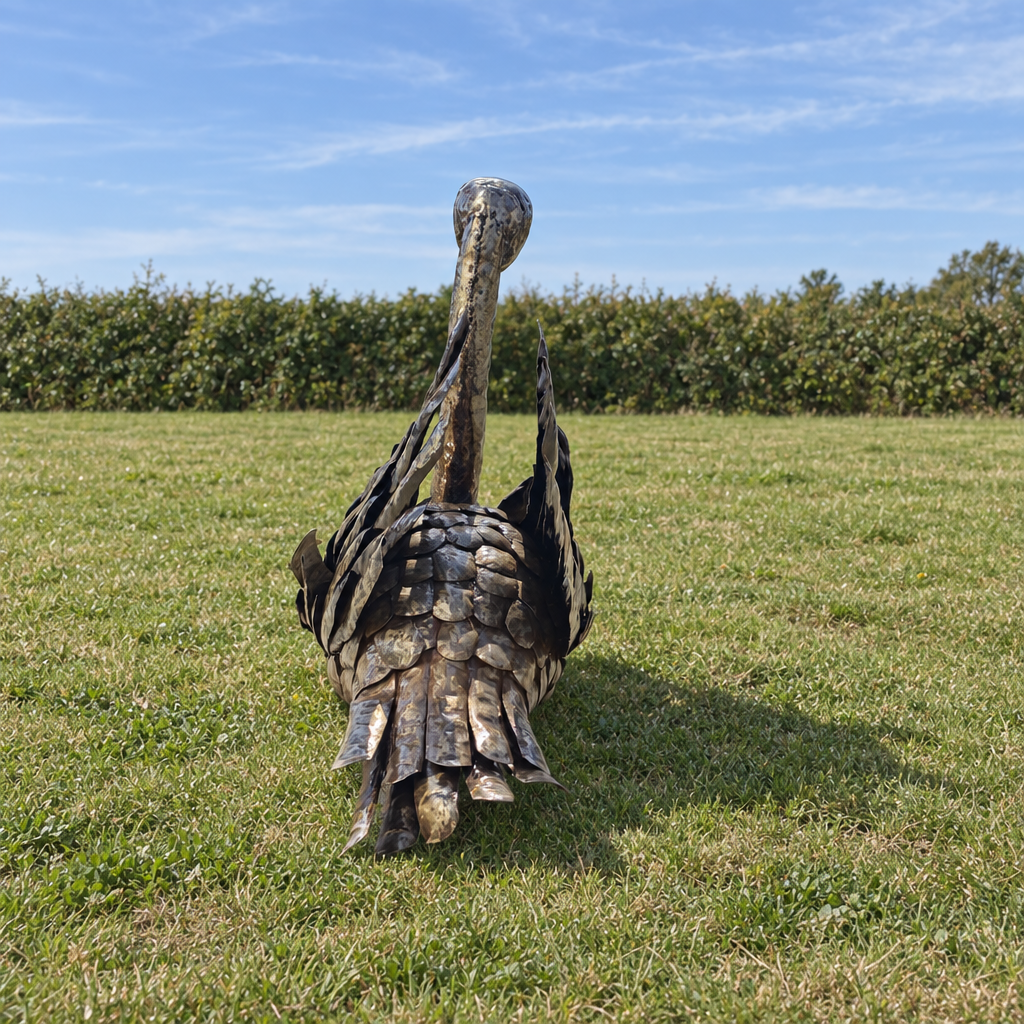Swan Sculpture - Raised Wings, rear view in an outdoor setting