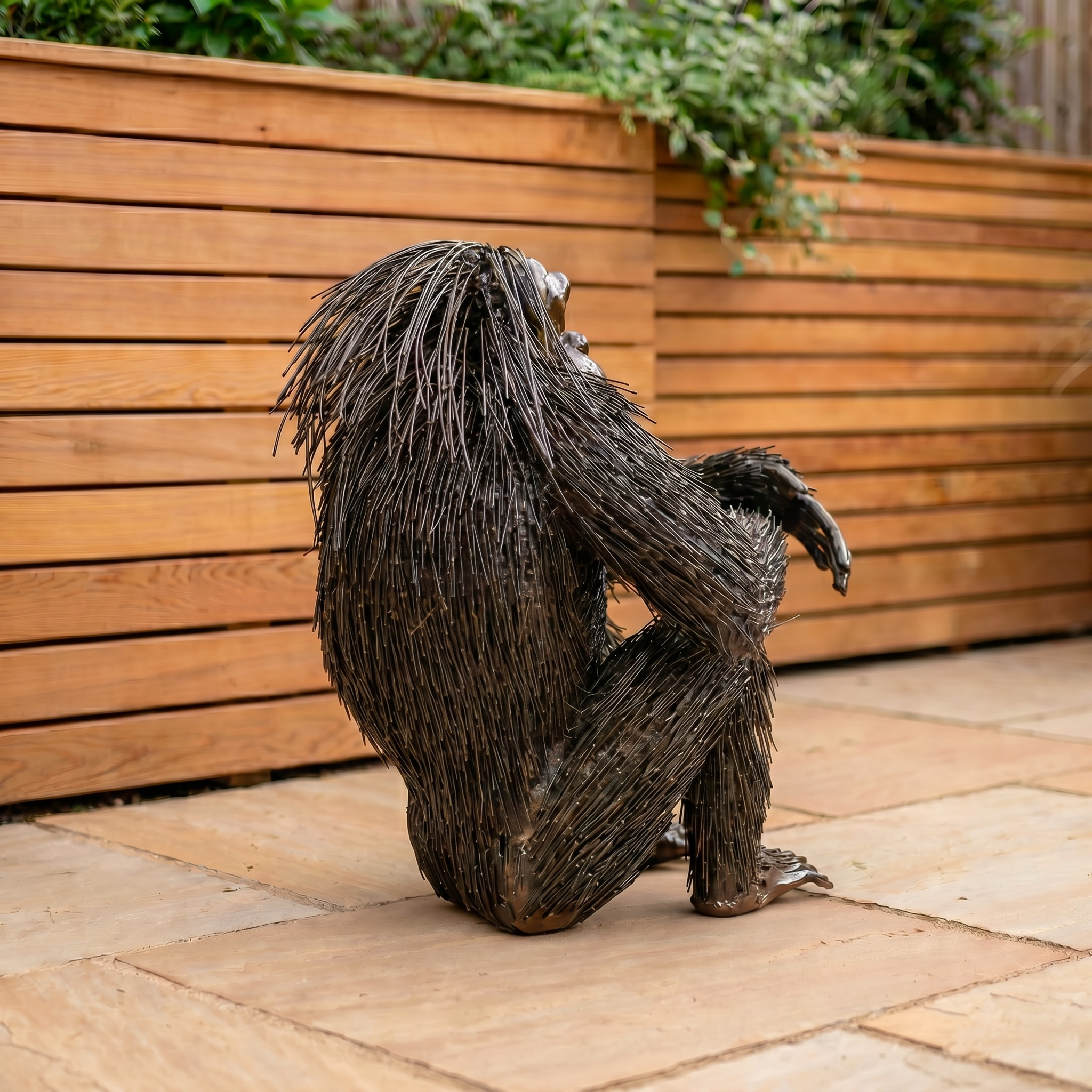 Knee-Resting Chimpanzee Sculpture