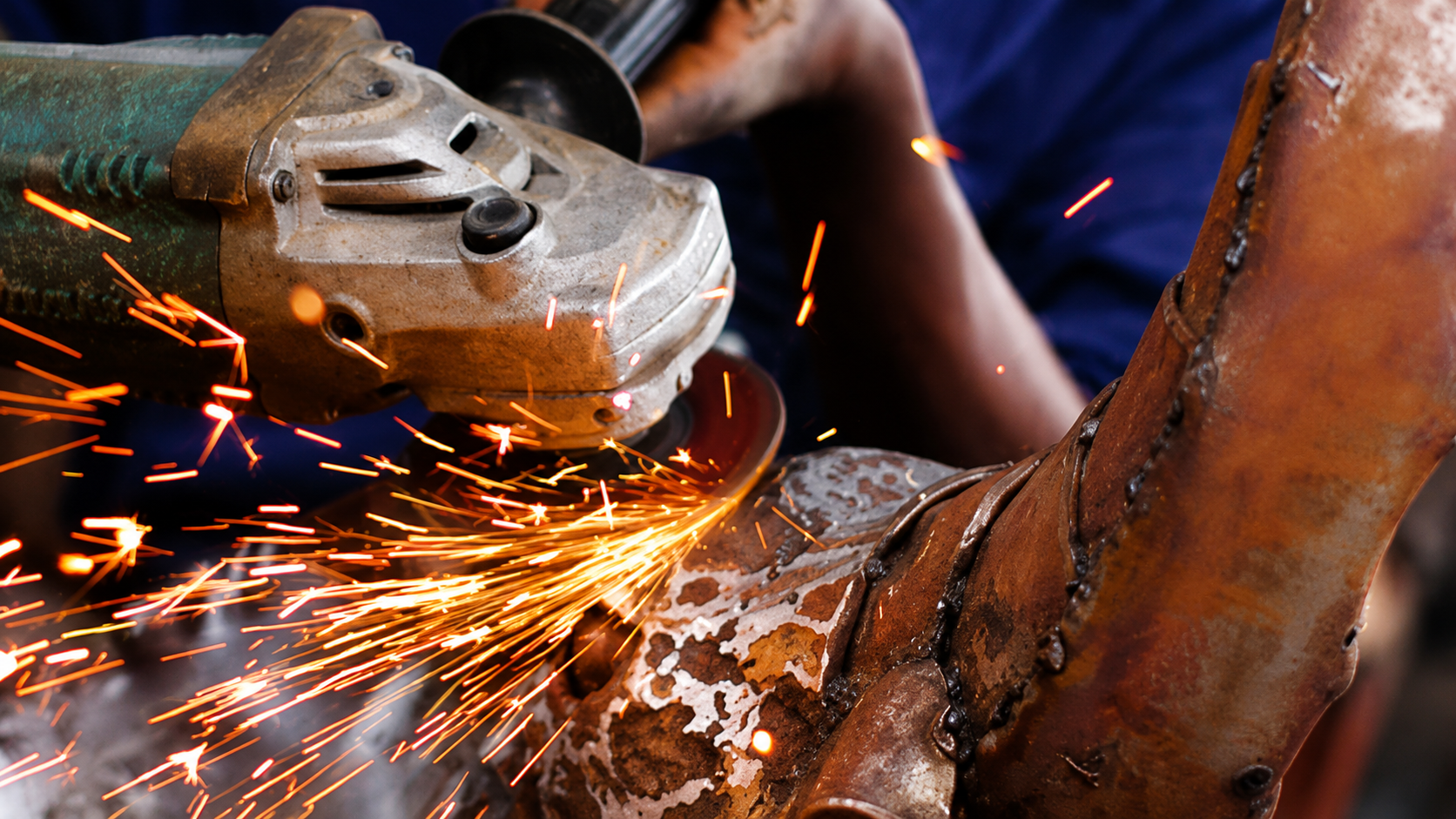 Sparks from metal sculpture grinding and finishing