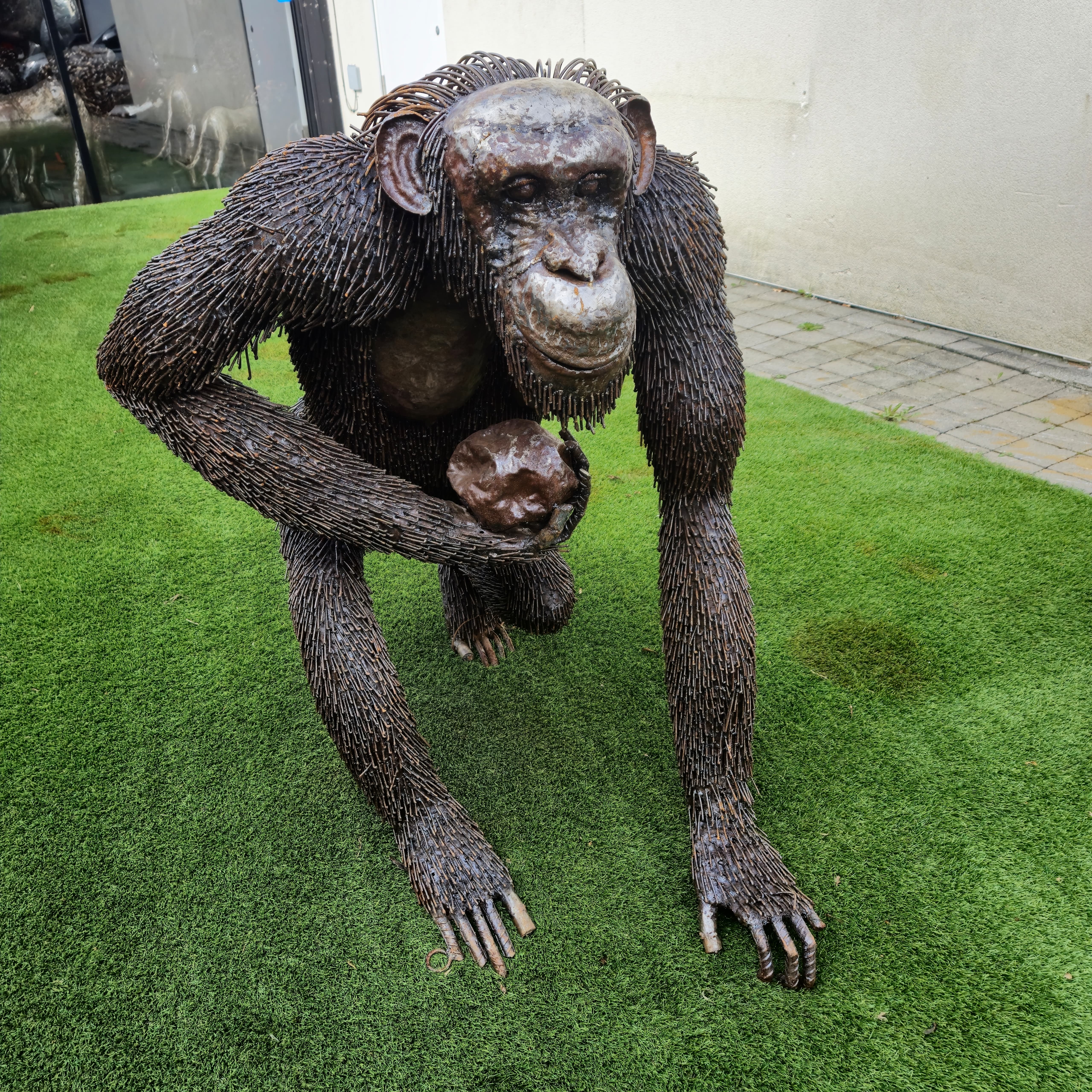 Sitting Chimp Metal Sculpture (Carrying Rock)