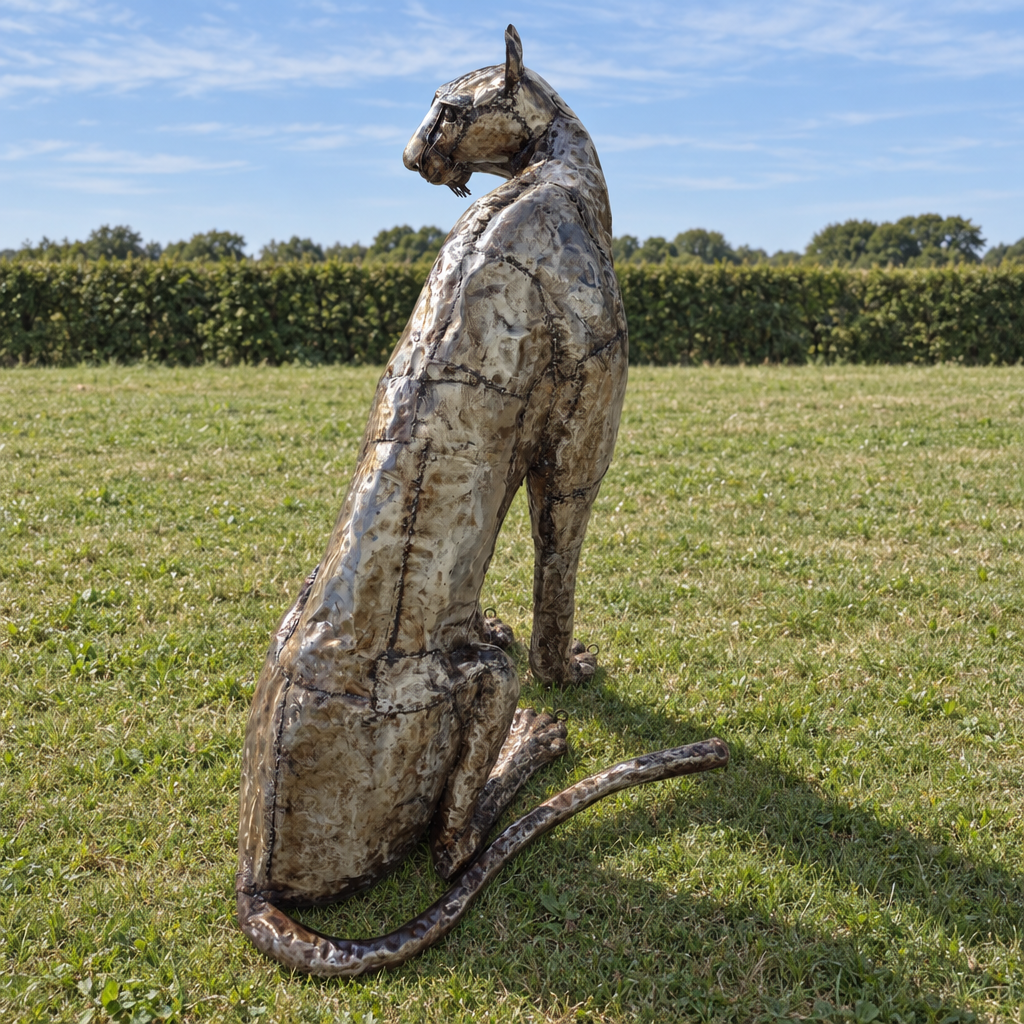 Sitting Cheetah Sculpture - Looking Left, rear view in an outdoor setting