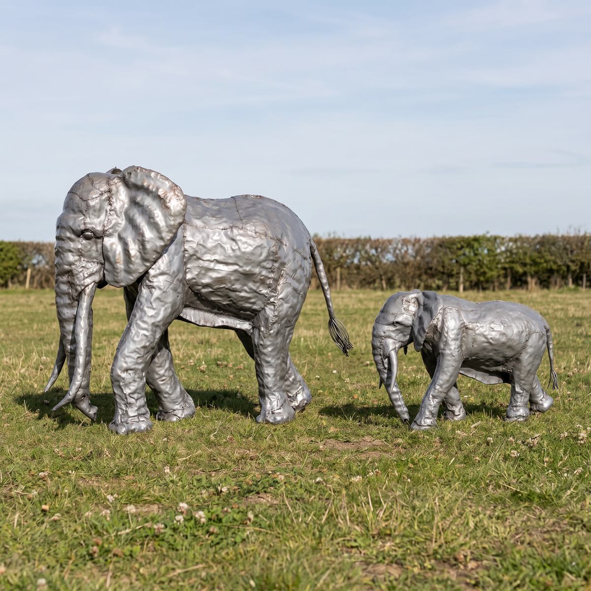 Silver-grey 4ft and 2ft elephant sculpture bundle, field angled